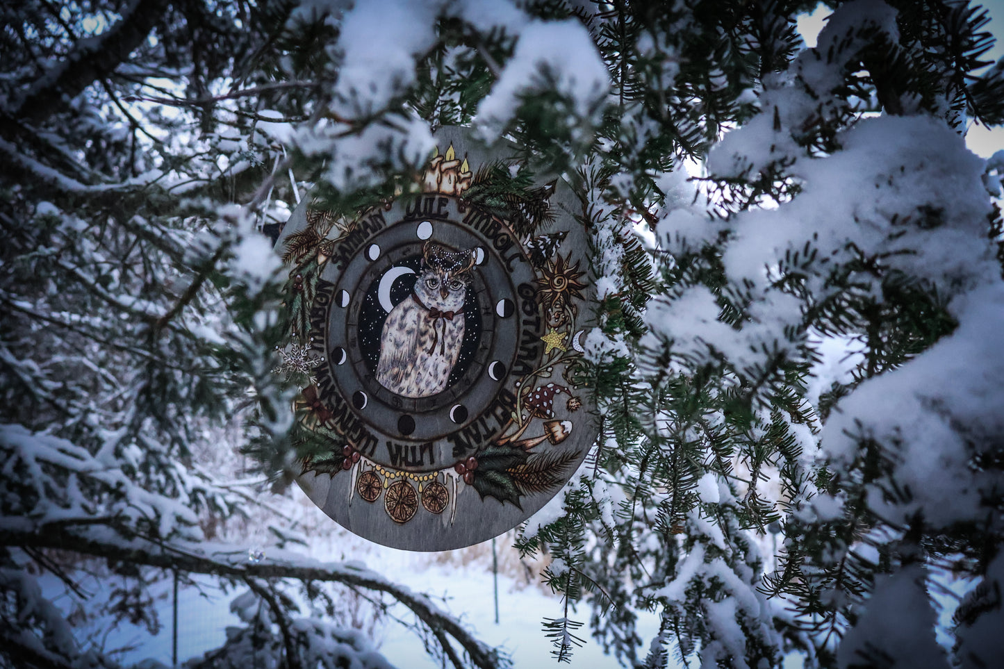 Woodburned wheel of the year for yule witchmas for the pagan season with snowy owl and moon phases, astrological symbols for pagan and witches and wiccans