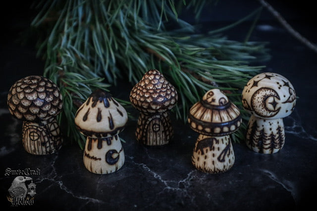 Hand woodburned wooden mushroom figurines with cottage, whimsical, moon, inkycap, and ufo alien mushie handmade by www.smokecrafthollow.com