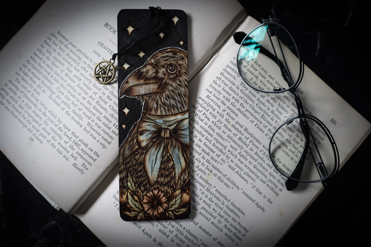 Raven Bookmark for Witchy familiar gifts for pagans and bookworms and bibliophiles this hand woodburned bookmark by www.smokecrafthollow.com will make the perfect witchmas gift for any reader.