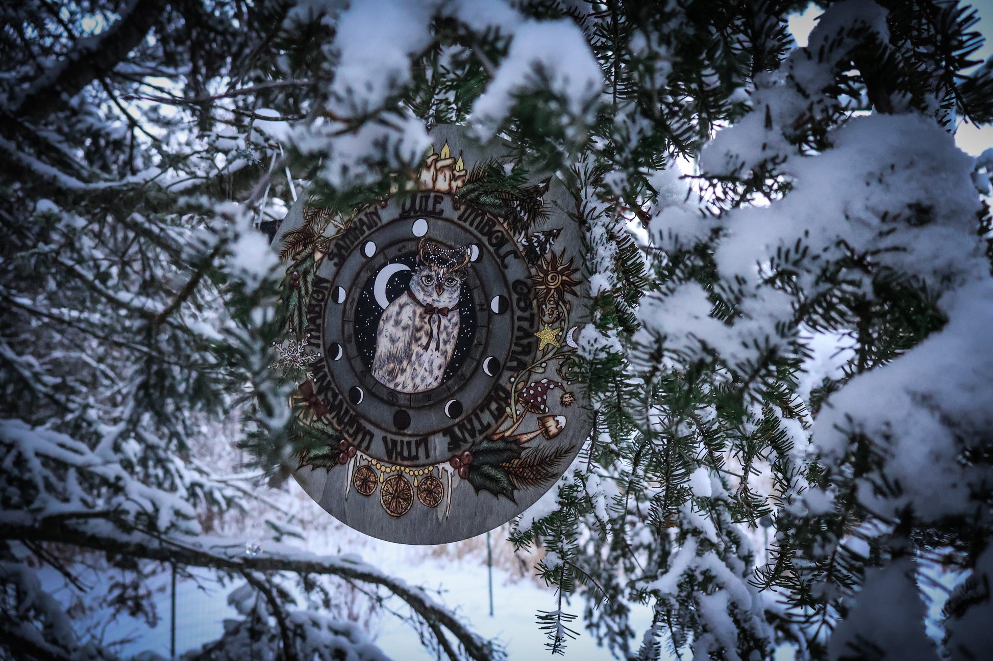 Woodburned wheel of the year for yule witchmas for the pagan season with snowy owl and moon phases, astrological symbols for pagan and witches and wiccans 