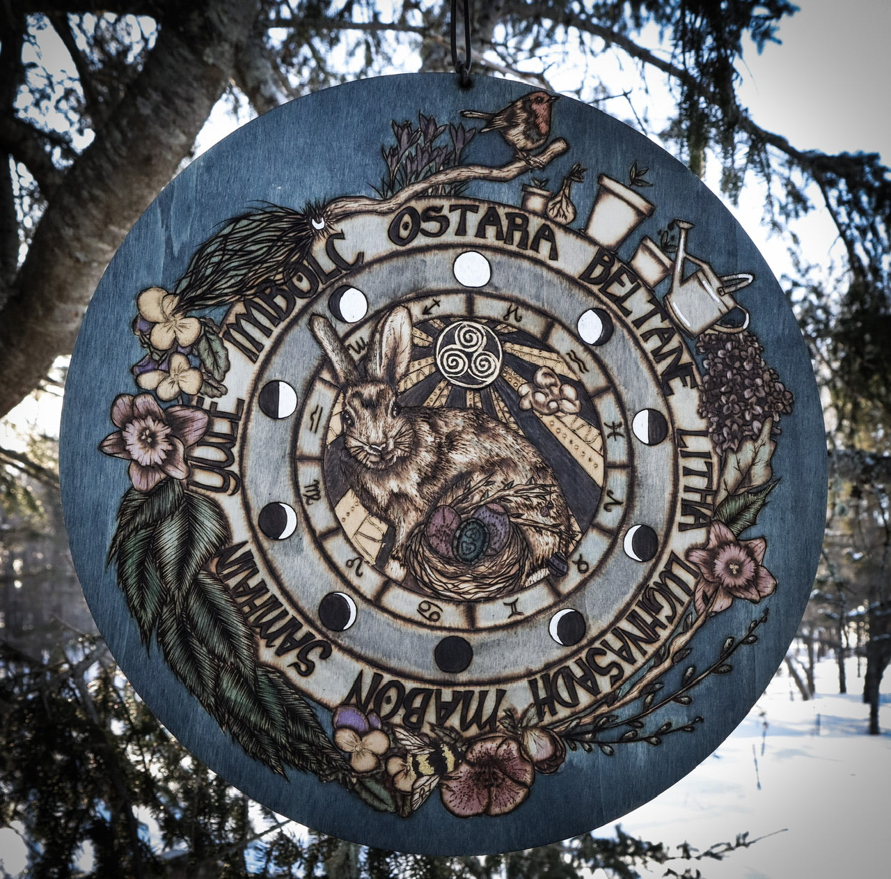 Woodburned Ostara Wheel of the year for witches celebration of the pagan sabbath or the spring equinox with flower, hare, eggs by www.smokecrafthollow.com