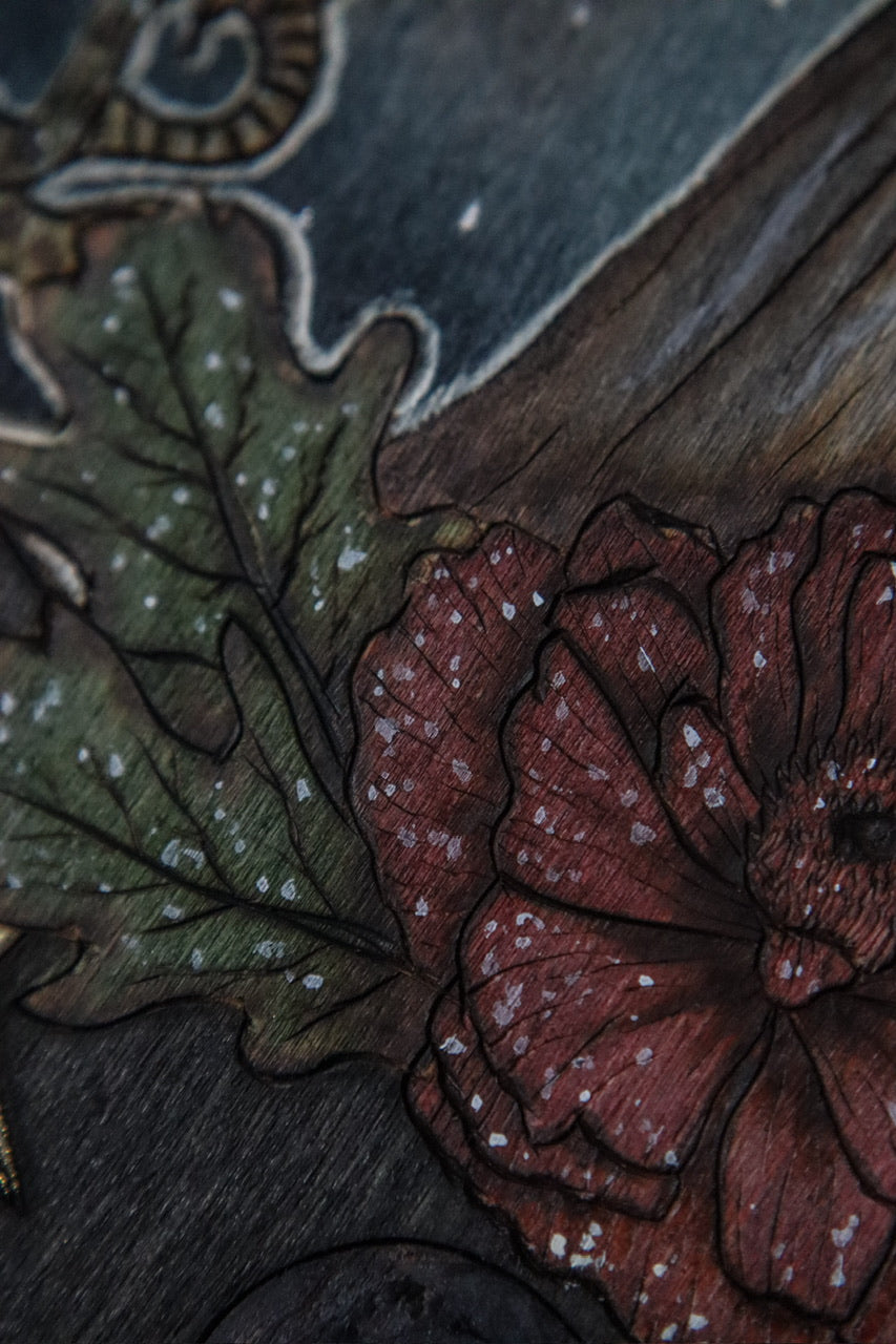 Woodburned wall plaque art decor of Slavic Goddess Mara Marzanna with poppy and oak leaves, nautical stars, and moon phases by www.smokecrafthollow.com